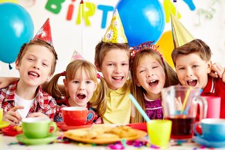Group of five children at a birthday party